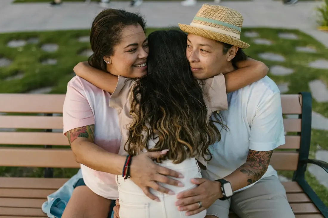 A family sharing an embrace — stories of connection and healing