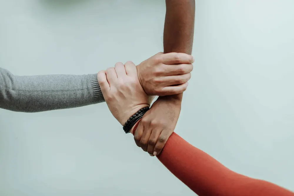 Hands joined in support